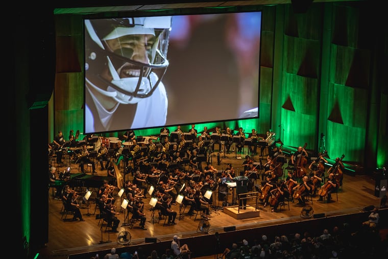 The Philadelphia Orchestra played an original score credited to "NFL Films." Anthony Parnther (wearing a midnight green “MAESTRO 1” Eagles jersey) was the conductor