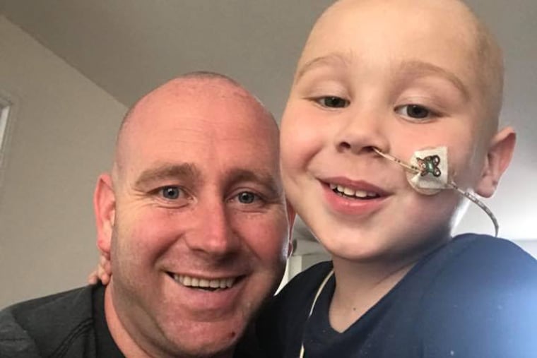 Zac Oliver with his father, Mark Garbett