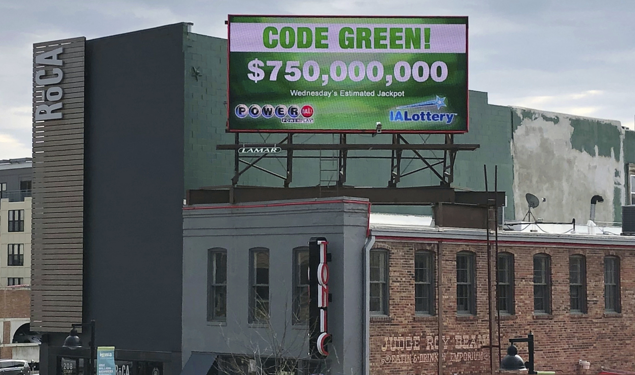 A billboard promotes an estimated $750 million Powerball jackpot in downtown Des Moines, Iowa, Wednesday, March 27.2019. (AP Photo/Scott McFetridge)