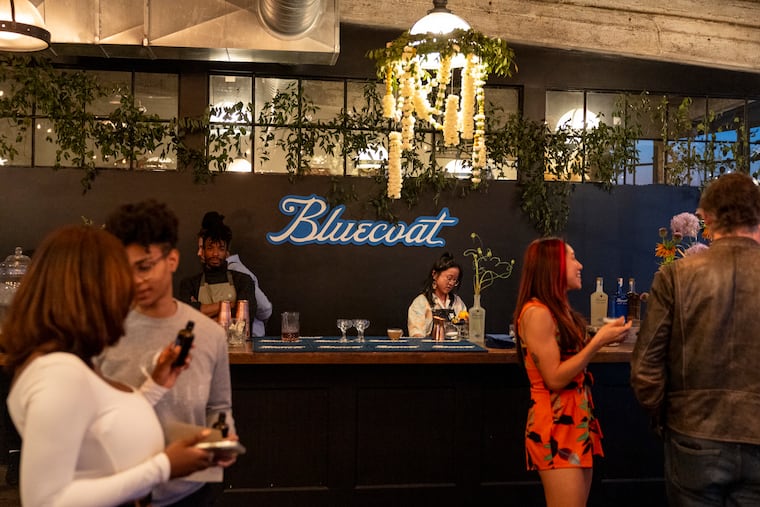 The Botanicals in Bloom bar, a 2025 pop-up event at Philadelphia Distilling. The company uses historical imagery to help market its signature Bluecoat Gin.