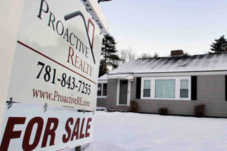 A house for sale in Millis, Mass., looks tended despite snow. "You need to pull every trick out of your hat in order to even get a showing," one agent said. (Steven Senne / AP)