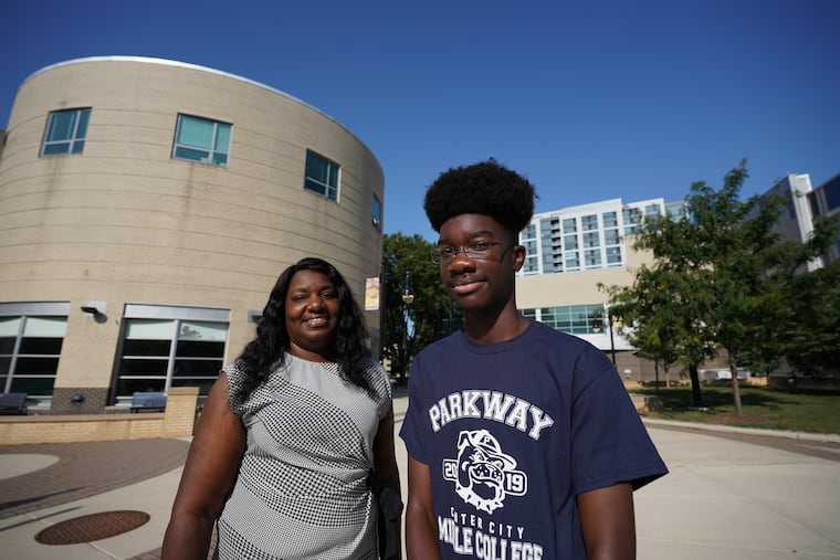 Parkway Center City Middle College (PCCMC) students Tanya Pressley, left, and her son Donald Pressley Jr., right, shown here on campus after a press conference to give information about Parkway Middle College HS, where students earn HS diplomas and associates degrees at CCP concurrently, at Philadelphia Community College, in Philadelphia, July 25, 2019.