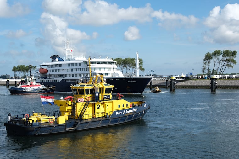 The MV Hondius cruise ship, center, arrives at the Port of Rotterdam, Netherlands, Monday, May 18, 2026.