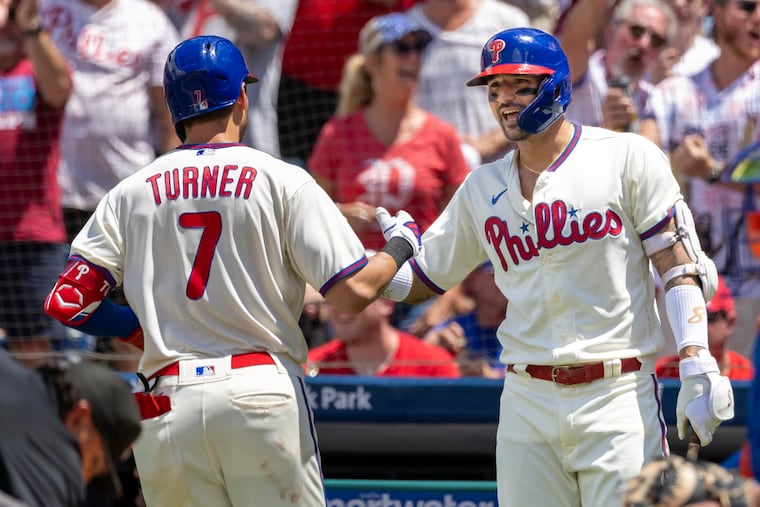 Trea Turner is greeted by Nick Castellanos after hitting a home run during the first inning of against the New York Mets on June 25.