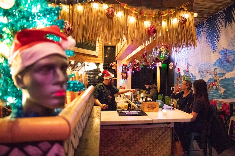 Brittany Stanton, 29, of Fishtown, left, and Shannon Brown, 30, of Bensalem, Pa., are Perinatal Sonographers at Jefferson Hospital and came to Tiki after work for a glass of wine before dinner on Thursday, Dec. 5, 2019.