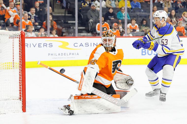 Flyers goaltender Felix Sandstrom uses his stick to stop the puck against Buffalo Sabres left wing Jeff Skinner in the first period.
