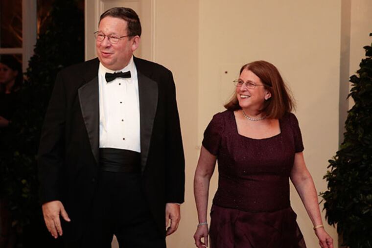 David Cohen, chairman of the University of Pennsylvania and former executive vice president of Comcast Corp., left, and his wife Rhonda Cohen arrive at a state dinner hosted by U.S. President Barack Obama and U.S. First Lady Michelle Obama in honor of French President Francois Hollande at the White House in Washington, D.C., U.S., on Tuesday, Feb. 11, 2014. (Andrew Harrer/Bloomberg)