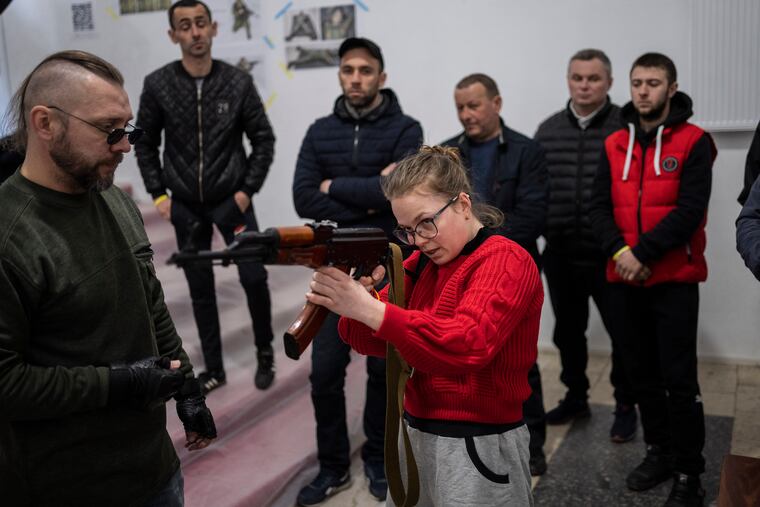 Ukrainian civilians receive weapons training in Lviv, Western Ukraine, Saturday, March 19, 2022. Fighting raged on multiple fronts in Ukraine more than three weeks after Russia's Feb. 24 invasion. U.N. bodies have confirmed more than 800 civilian deaths since the war began but say the real toll is considerably higher. The U.N. says more than 3.3 million people have fled Ukraine as refugees.