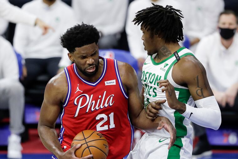 Sixers center Joel Embiid runs into Boston Celtics center Robert Williams III on Friday, January 22, 2021 in Philadelphia.