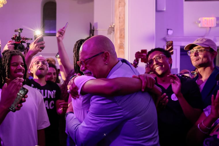 State Rep. Chris Rabb hugs his son, Issa Rabb, during his primary election night event at Victorian Banquet Hall Tuesday, May 19, 2026, in Philadelphia.