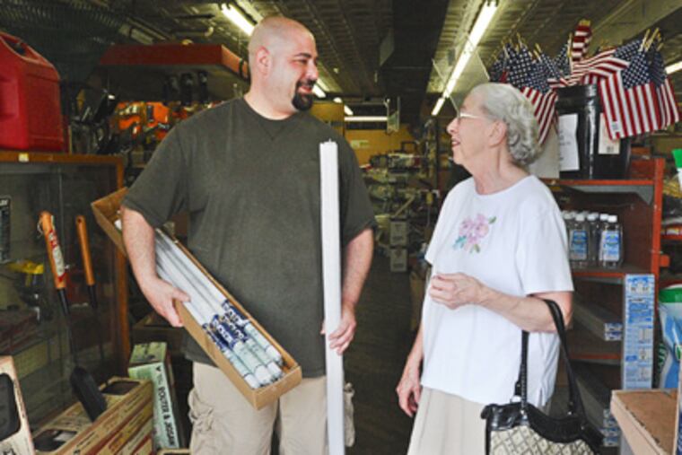Josh Beerson of Marcus Hook Hardware still gives personal attention to local residents like Eleanor Nealy, 82, who has been coming to the store for more than 50 years. (Sharon Gekoski-Kimmel / Staff Photographer)