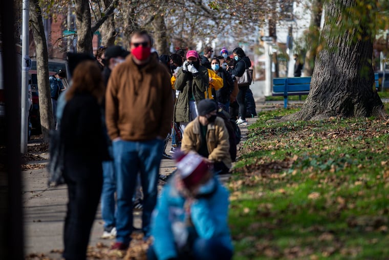 People wait in a line wrapping around Mifflin Square Park for COVID-19 testing with Philadelphia Flight and SEAMAAC in South Philadelphia, Pa., on Thursday, Nov. 19, 2020.