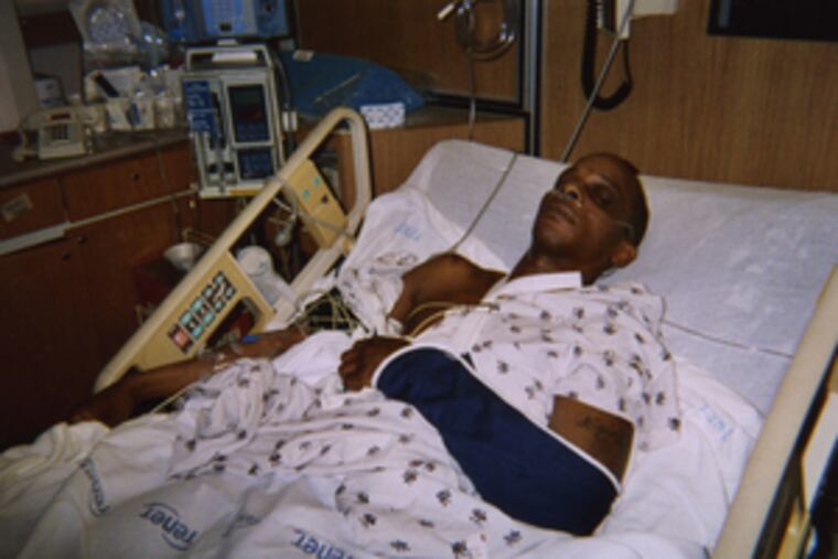 Kyle Byrd lies in hospital bed after March altercation involving several police officers.