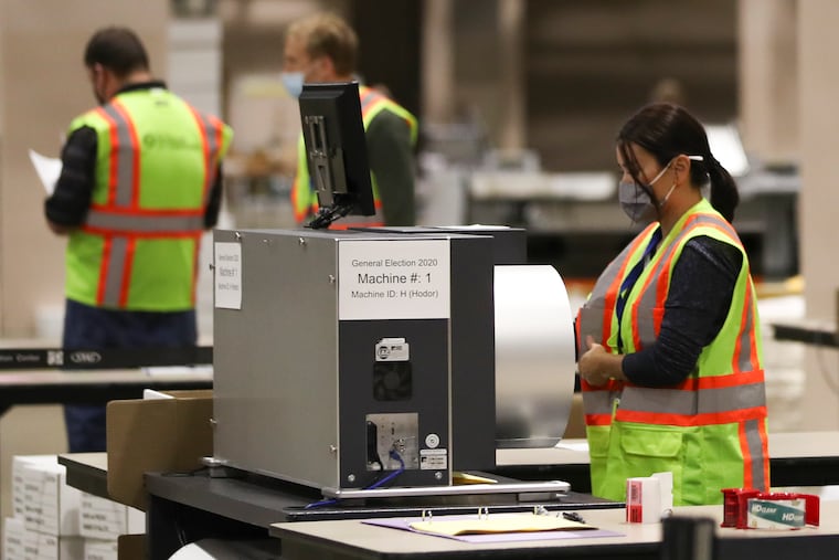 Ballots are counted inside the Pennsylvania Convention Center in Philadelphia on Election Day last year.