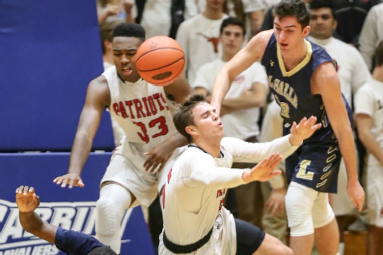 Germantown Academy’s Tim Guers, diving for a loose ball against La Salle earlier this month, is the reigning Inter-Ac League MVP.