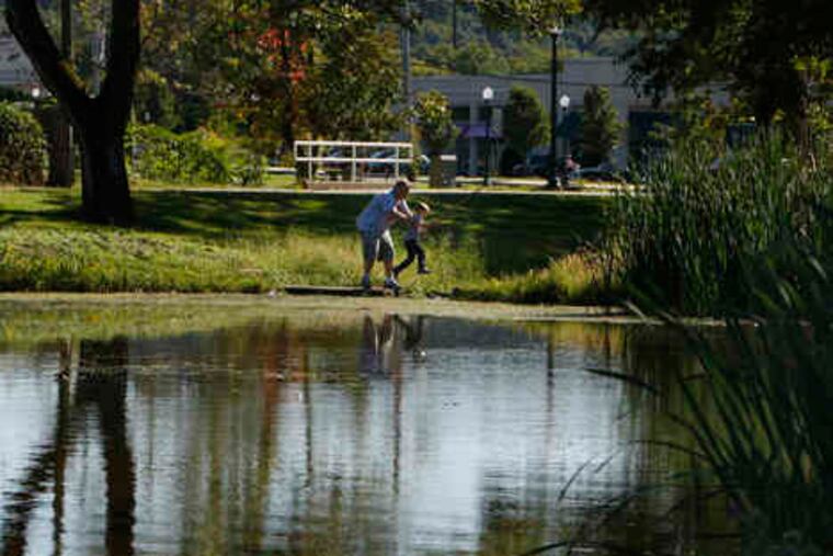 Doug Rider Sr. picks up his grandson Max Rider, 5, at Kardon Park. "There has been a planto develop this area for 15 years, and no one complained," Downingtown's solicitor said.
