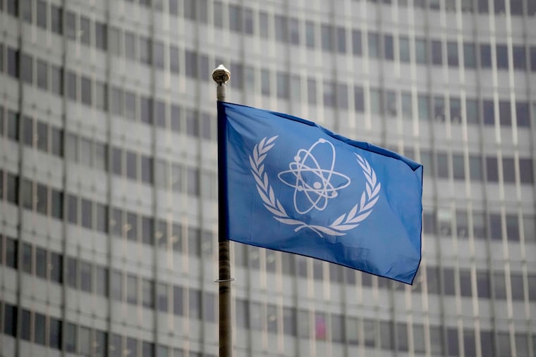 The flag of the International Atomic Energy Agency flies in front of its headquarters in Vienna, Austria, in 2023.
