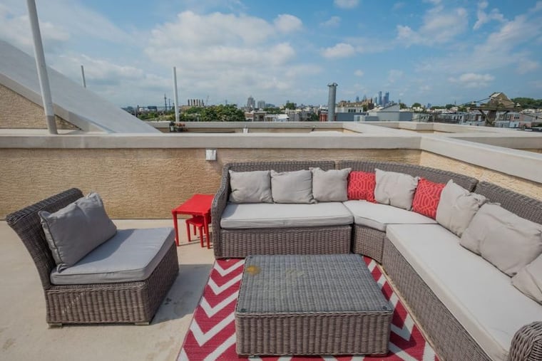 A rooftop deck offers a view of Philadelphia.