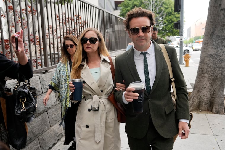 Danny Masterson, right, and his wife Bijou Phillips arrive for closing arguments in his second trial on May 16 in Los Angeles. A jury found “That ’70s Show” star Masterson guilty of two counts of rape in a retrial in which the Church of Scientology played a central role.