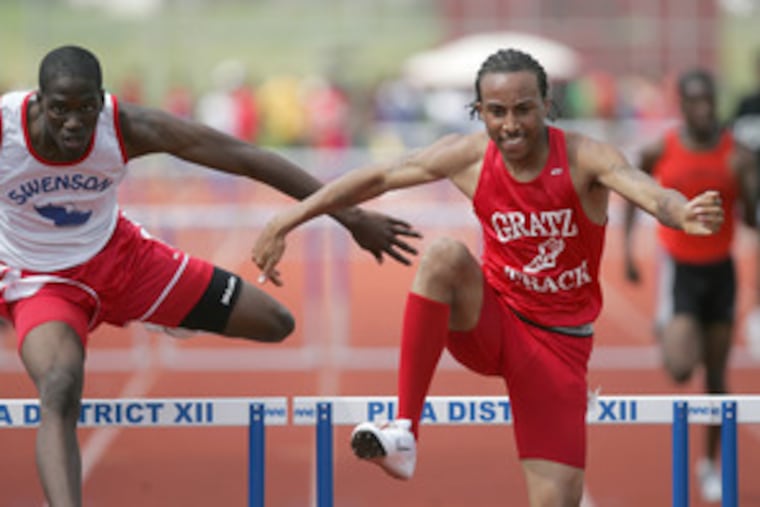 Simon Gratz's Frank Wainwright has the lead on Swenson's James Reid as he heads for victory in the 300 hurdles.