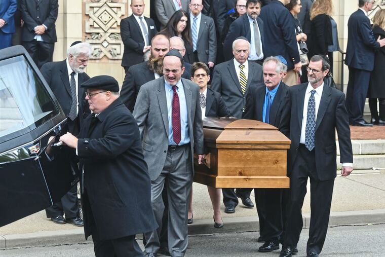 Pallbearers carry the caskets of Cecil and David Rosenthal following the funeral at Rodef Shalom Congregation on Tuesday, Oct. 20, 2018, in Shadyside.