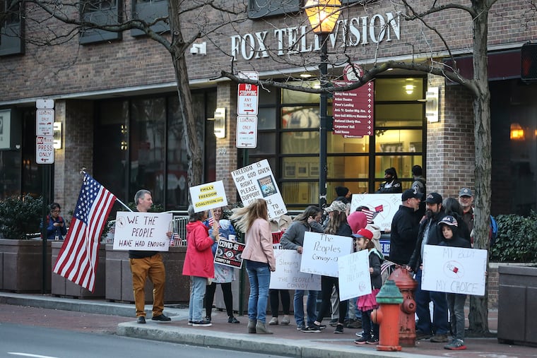 Some 19 people stood in front of the Fox 29 offices on Market Street in Old City on Friday to demand more coverage of a small but ongoing trucker protest taking place outside Washington, D.C.