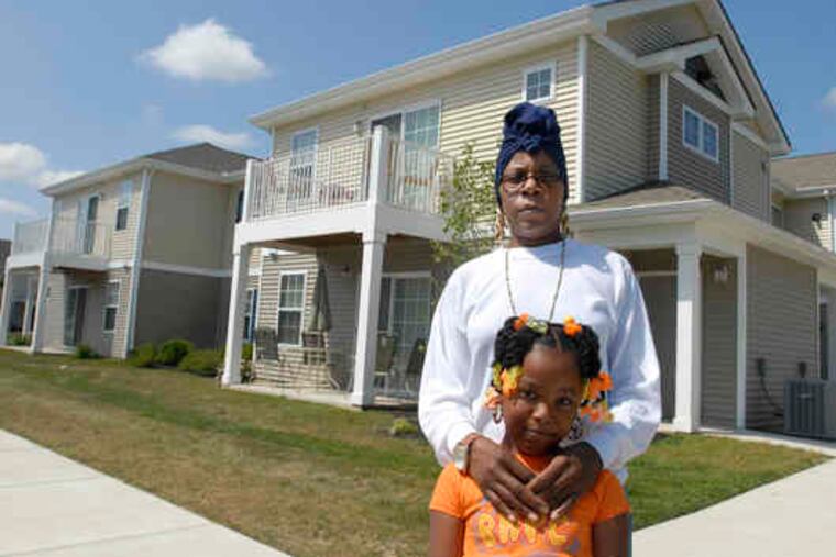 Tamika Tokley and her granddaughter Ja'Niah Kendrick, 6, have a unit in the Evesham complex. The housing joint ventures blend for-profits' access to capital and nonprofits' community ties.