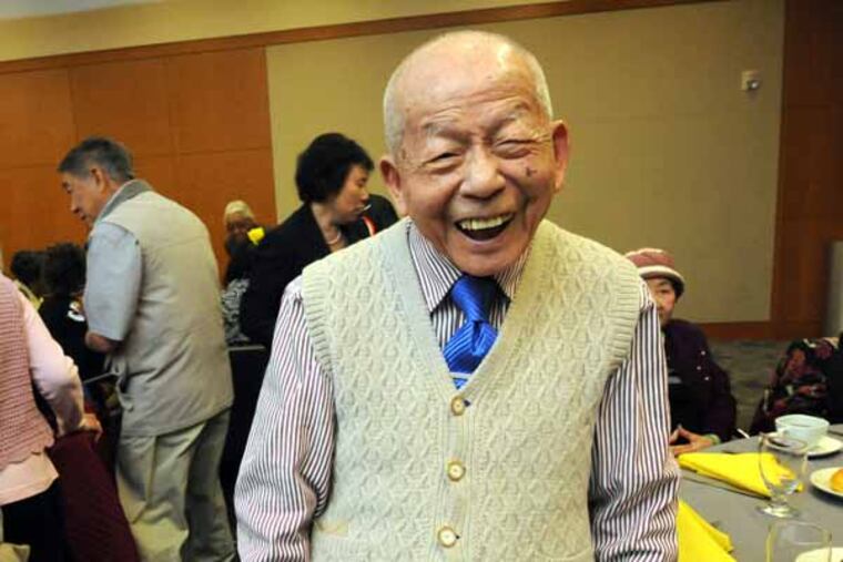 May is Older Artists month; thus, the Philadelphia Corporation for Aging is hosting a lunch for 150 seniors, who are also artists at the PECO building on 5/3/13. Here, Yuk Fai Tsang, who is 100. ( APRIL SAUL / Staff )