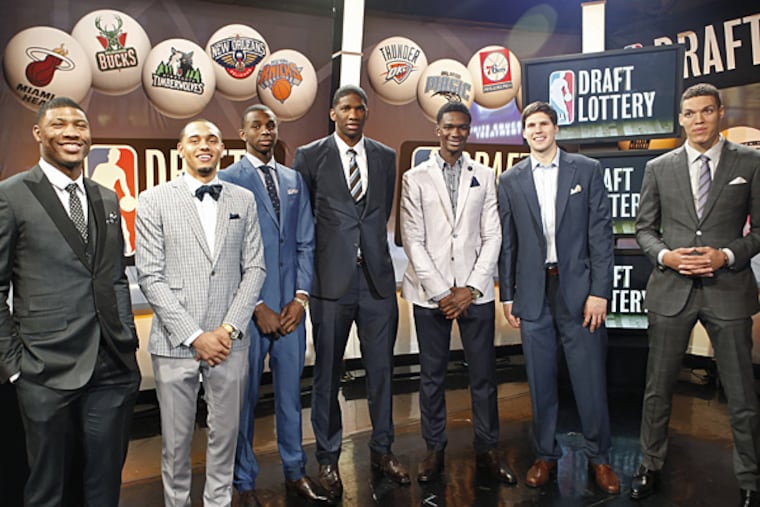 The Sixers won the third pick in the 2014 NBA draft and selected Joel Embiid (center).
