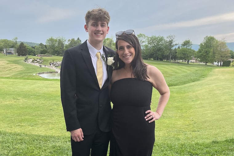 Traci Hafner poses with her son, Garrett Nicholas, before his senior high school prom in May 2023.