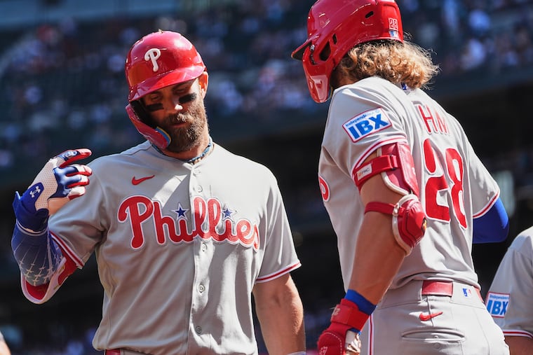 Bryce Harper greets Alec Bohm (28) after hitting a two-run home run during the first inning on Wednesday.