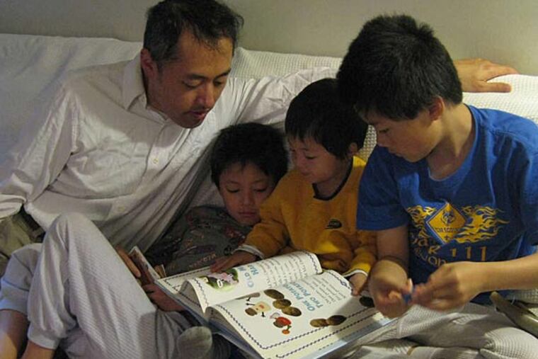 A typical morning in the Chen homeschool: (from left) dad Sterling; Nathanael, 8; Micah, 3; and Isaiah, 11.