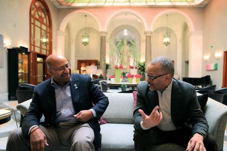 Mayor Michael Nutter, left, and Everett Gillison, right, his Chief of Staff, talk with reporters in the lobby of their hotel in Rome, Italy on March 24, 2014. ( DAVID MAIALETTI / Staff Photographer )