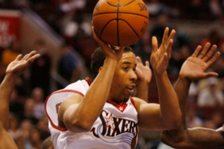 The Sixers' Andre Miller passes in the first half. He had 19 points and Willie Green contributed 18 to lead seven players in double figures. Gerald Wallace led Charlotte with 21.