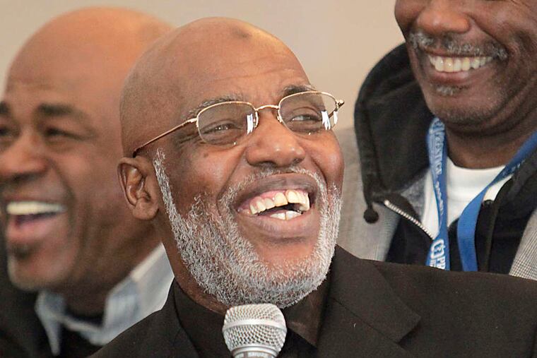 Kenneth Salaam, center, received the Harris Wofford Active Citizenship Award in January 2012.