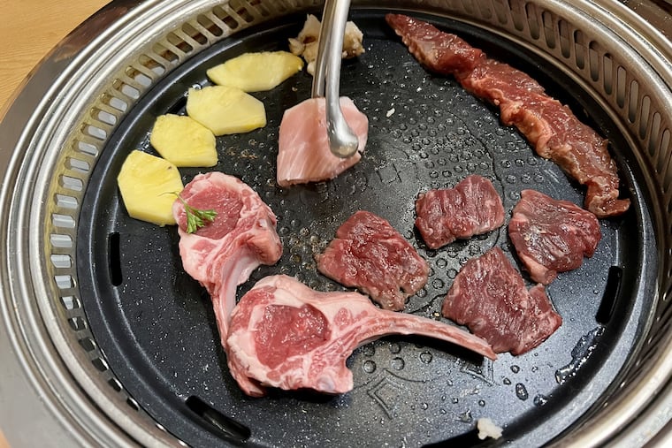 Tabletop cooking at Jomon Japanese BBQ, 1310 Walnut St.