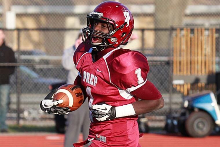 St. JosephÕs Prep #1 Olamide Zaccheaus runs for TD while
chased by Neshaminy #44 Devon Brown at 2nd QT. St. JosephÕs Prep won
37 to 21 over Neshaminy.
12-07-2013( AKIRA SUWA / Staff Photographer )
St. Joseph's Prep plays Neshaminy in the PIAA state Class AAAA
football semifinals, 3 p.m. at Northeast.