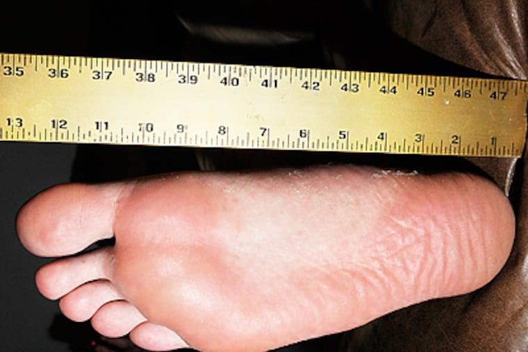 Connor Duffy, football player for Kingsway High School, can't find cleats to fit his size 22 feet. (Curt Hudson)