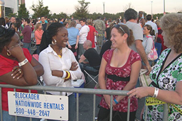 Long way to make friends (from left)s: Jessica Jennings brought her daughter, Nadcia, 18, up from Virginia, while Samantha Trudel, 17, came with her mother, Kathy, from Massachusetts. They were waiting outside the Wachovia Center around 6 a.m. Doors opened around 6:30.