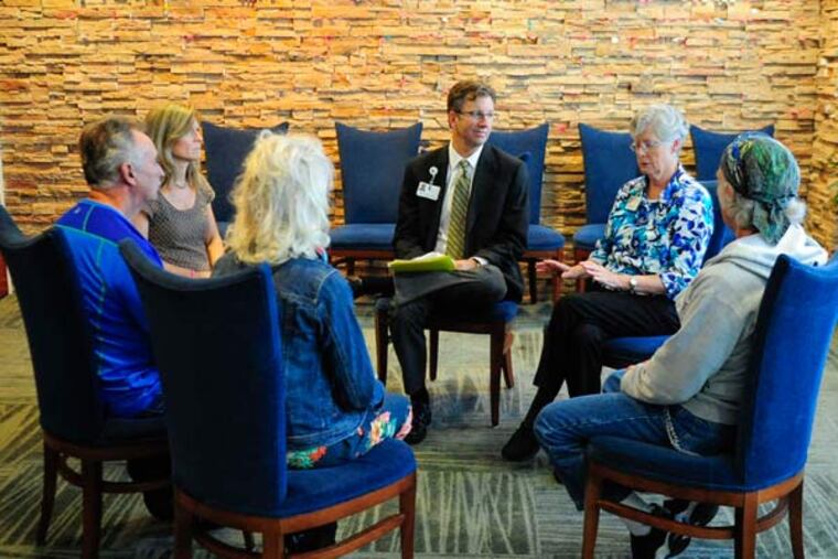 Patients join chaplain Drew Angus and Sister Anne McCoy at the Cancer Treatment Centers of America's hospital in Philadelphia.