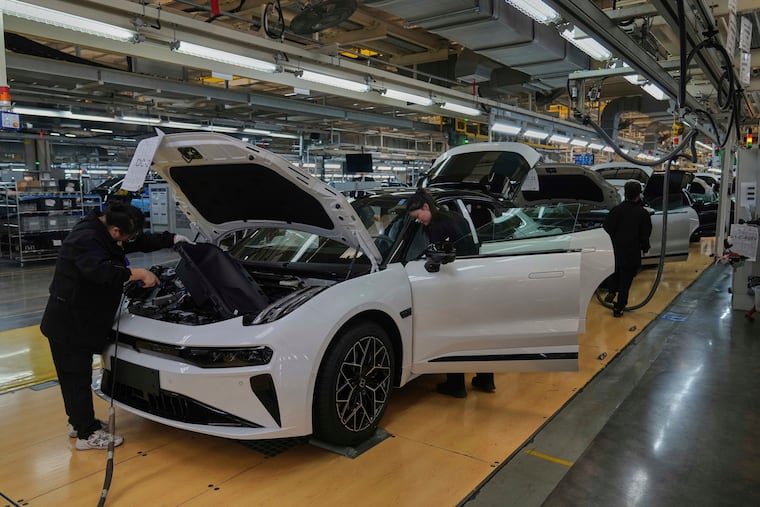 Workers assemble the Zeekr 001 EV models at the Chinese automaker Zeekr assembly plant in Ningbo, east China's Zhejiang Province, on Wednesday, April 17, 2025.