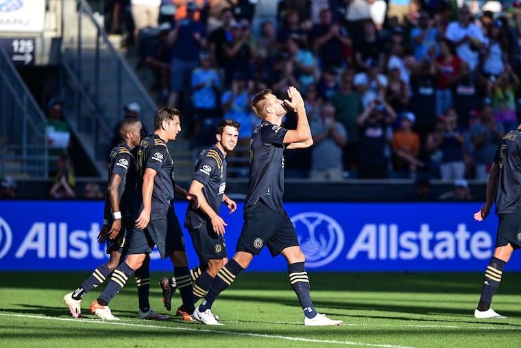 Kacper Przybylko celebrates scoring one of his goals in the Union's win.