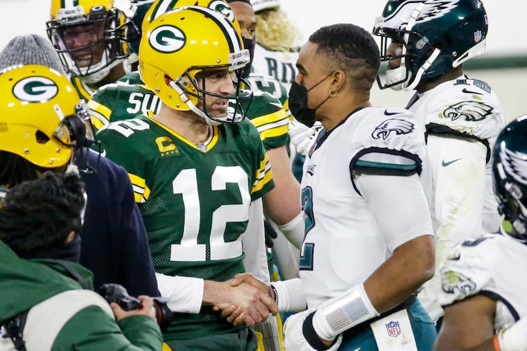 Green Bay Packers quarterback Aaron Rodgers (12) shook hands with Eagles quarterback Jalen Hurts on Dec. 6 after a 30-16 Packers victory.