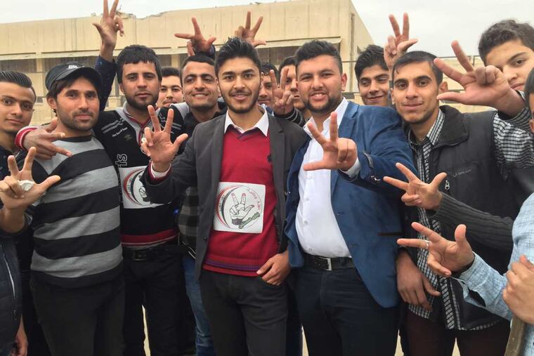 Student volunteers clearing the rubble at Mosul University.