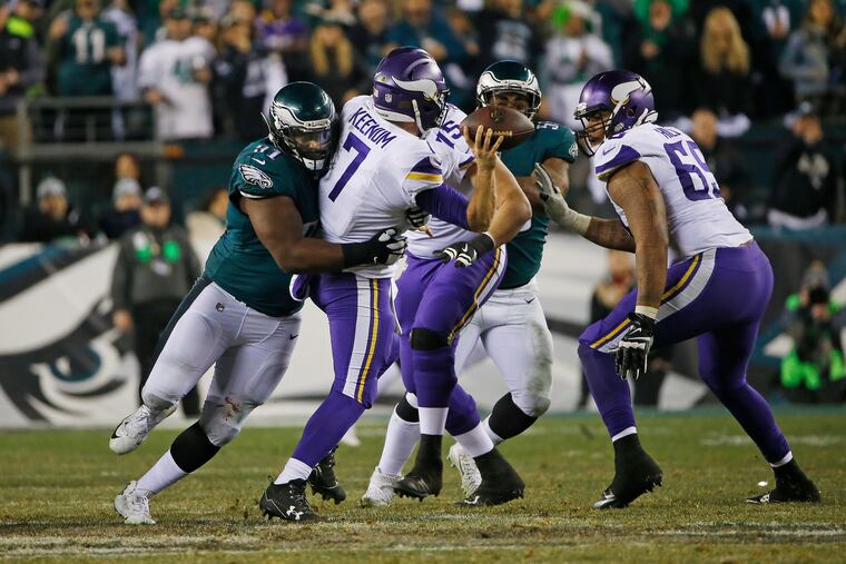 Eagles defensive tackle Fletcher Cox grabs hold of Vikings quarterback Case Keenum and affects his throw on fourth down in the fourth quarter of the 2017 NFC Championship game. The Eagles will see Keenum in Week 1 as Washington's opening-day starter.
