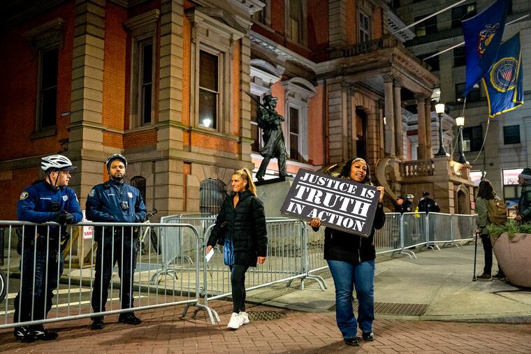 Sereshia Clark protests outside the Union League on Jan. 24 after Florida Gov. Ron DeSantis was honored by the group.