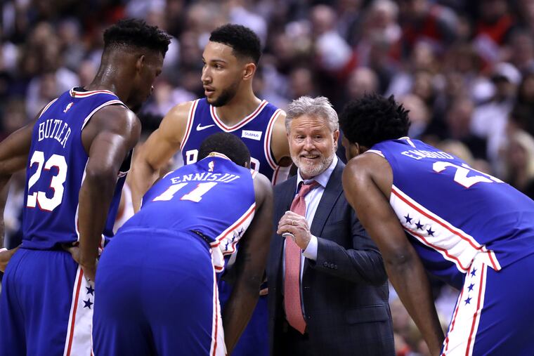 Sixers coach Brett Brown and his players during a break in action on Tuesday.