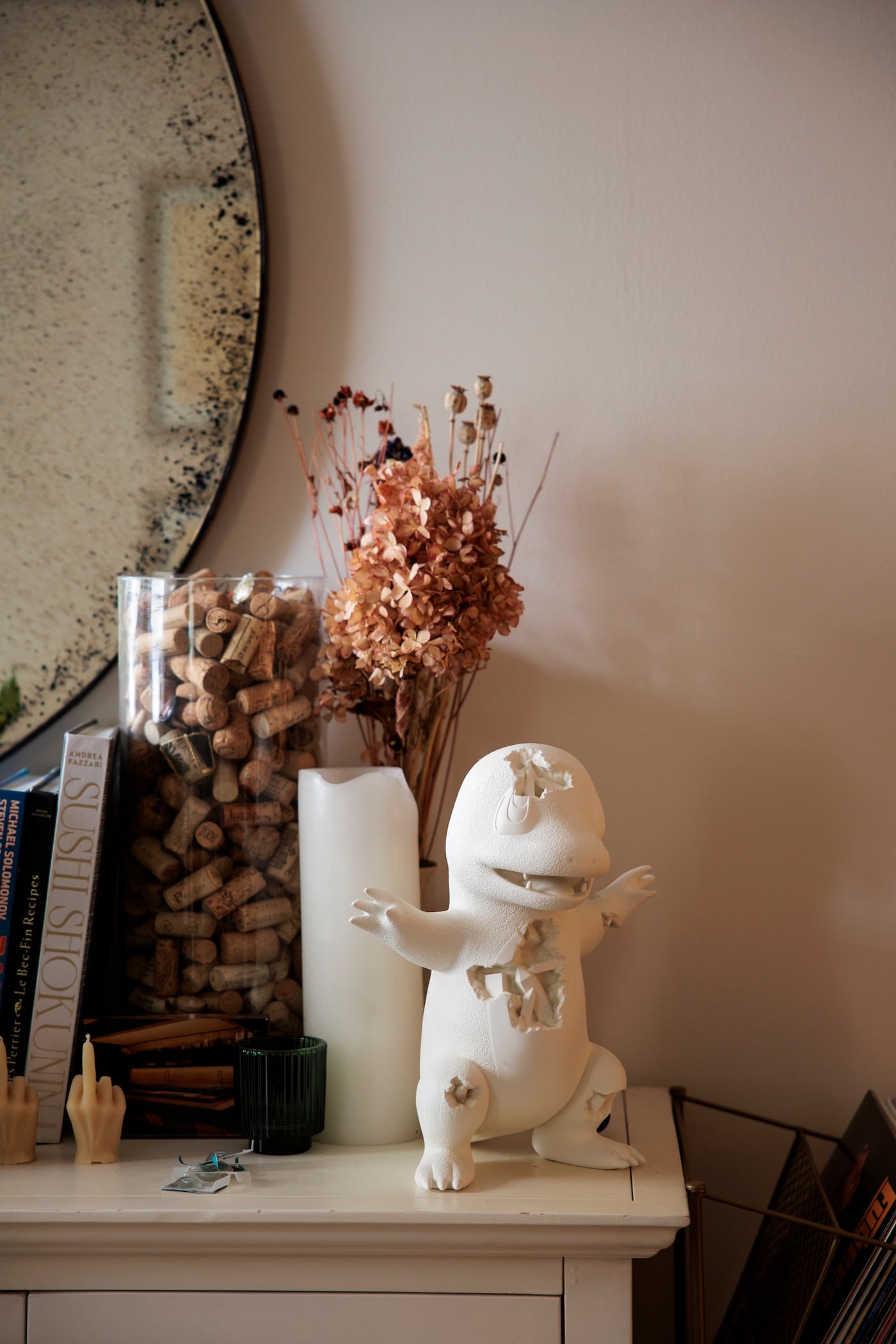 A huge Pokèmon fan, Ito has been given artwork inspired by the anime characters. A Charmander sculpture sits on a perch overlooking Ito's space.