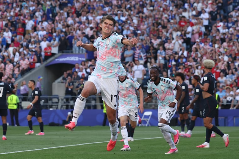Belgium's Charles De Ketelaere (center) celebrates after scoring one of his goals against the United States.
