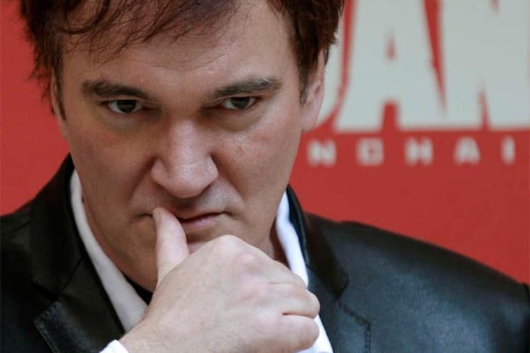 Director Quentin Tarantino looks at photographers during a photo-call to present his movie "Django Unchained" in Rome Friday.